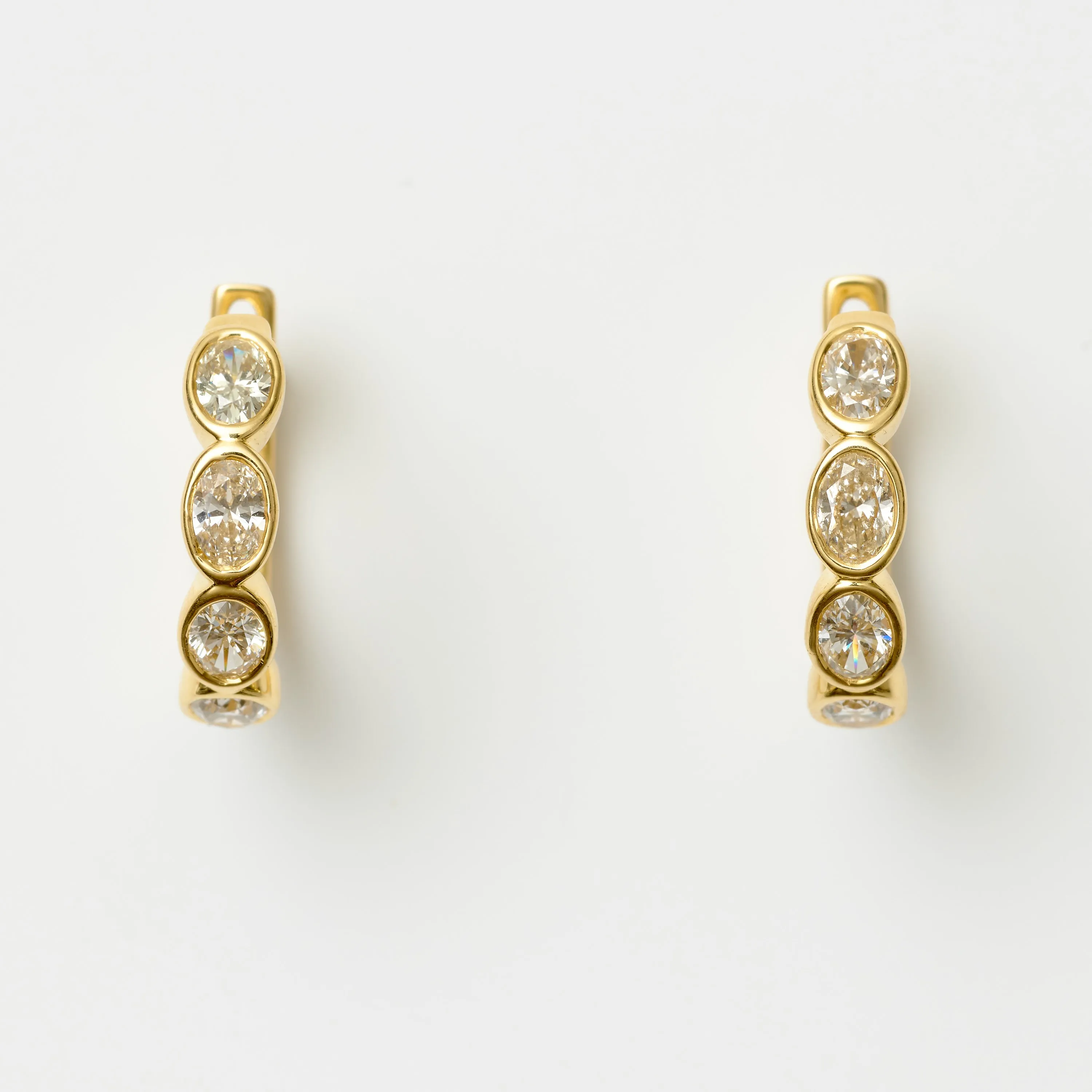 BEZEL-SET OVAL DIAMOND HOOPS